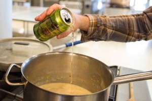 Pouring All Day IPA into a pot