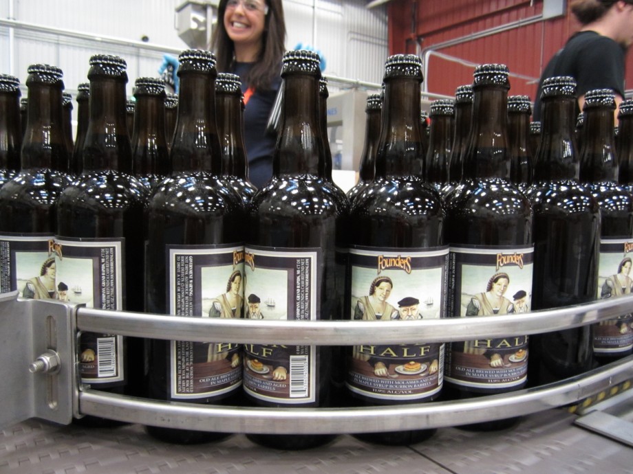 Founders Curmudgeon’s Better Half bottles on assembly line