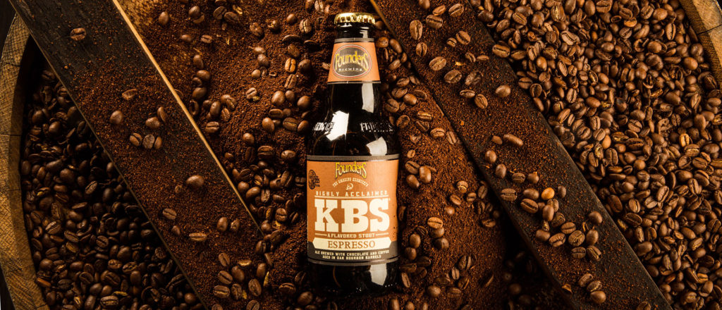 kbs espresso bottle laying on espresso beans