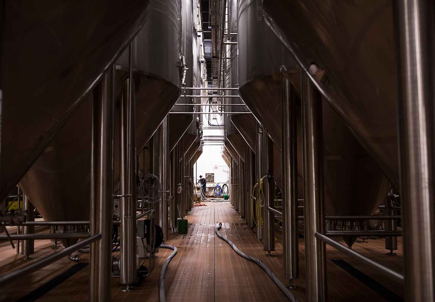 Darker image looking between brewery tanks