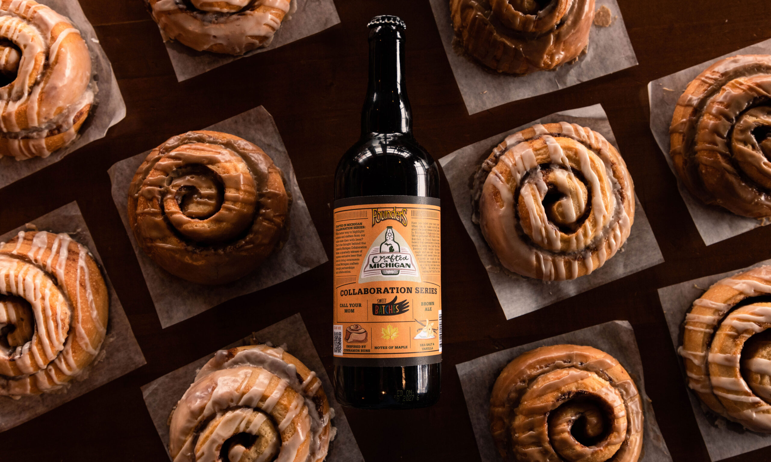  750 mL Bottle of Call Your Mom! amidst cinnamon rolls